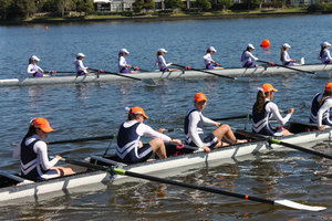 Female competitors rowing boats