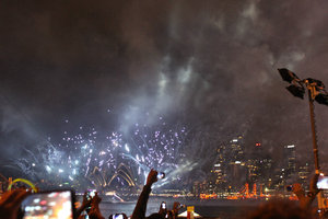 Fireworks on water in front of Opera House