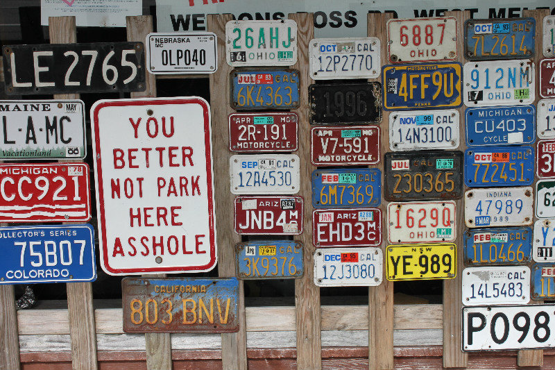 Car plates outside a shop in Ross town