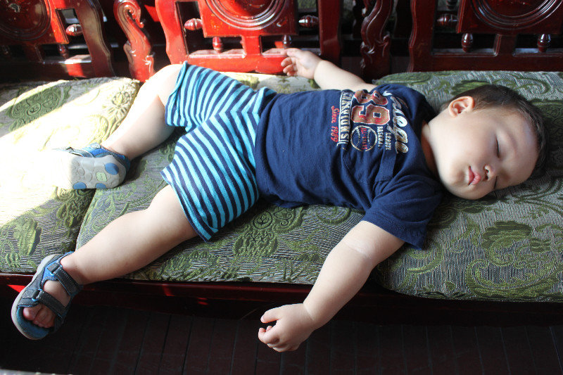 Kevin sleeping while cruising Hạ Long bay
