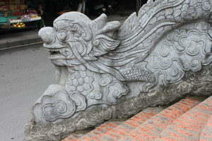 Stone dragon at Cửa Ông temple 