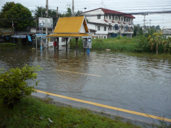 Bus stop under water.