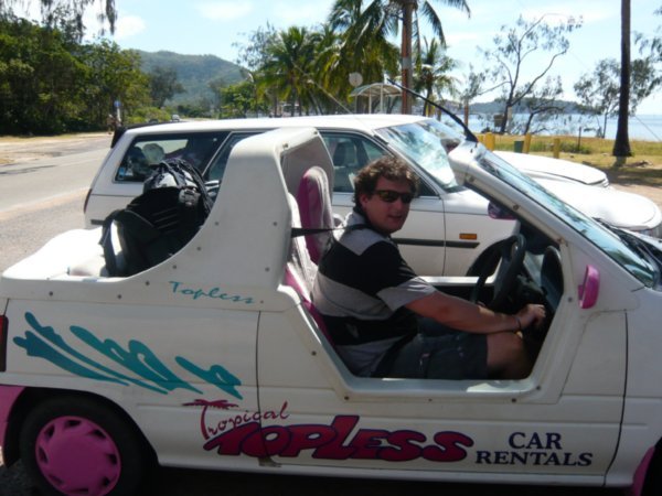 Luke posing in the Barbie Car with our backpacks!