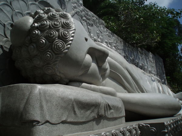 A large sleeping buddha inside the temple
