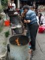 Street vendor cooking dumplings
