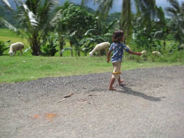 Girl walking along road