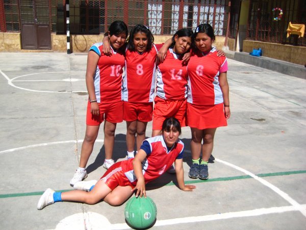 Playing basketball at Hogar Penny with new uniforms (thanks Mary!)