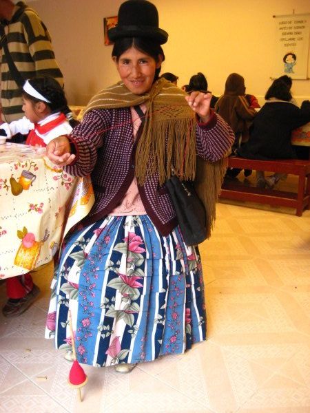 Traditional Bolivian lady would spin yarn everyday at the comedor