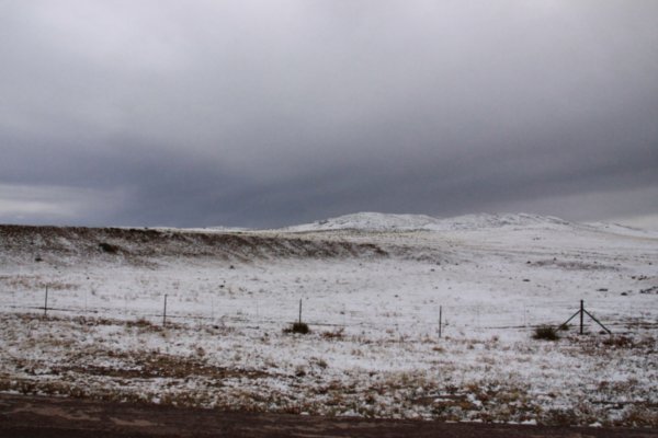 Driving through snowy plains while leaving Colorado