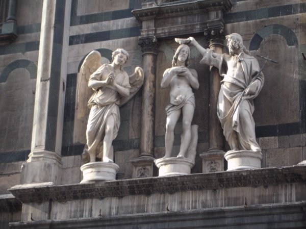 Statues of the Baptism of Jesus on above the bronze doors