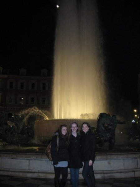Us in front of the fountain in the center of town