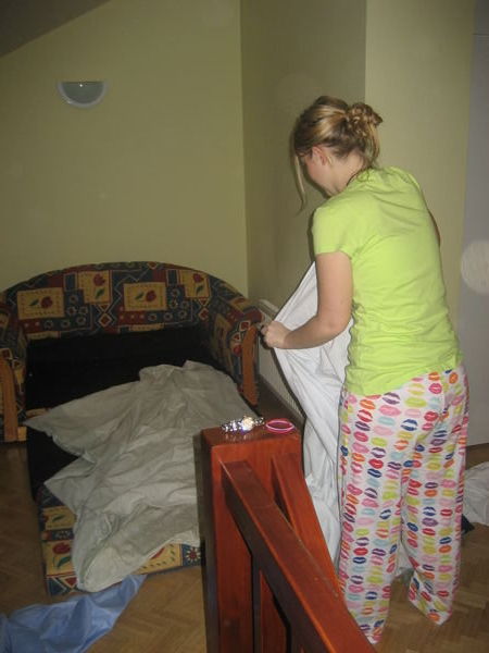 Denise making the bed. 