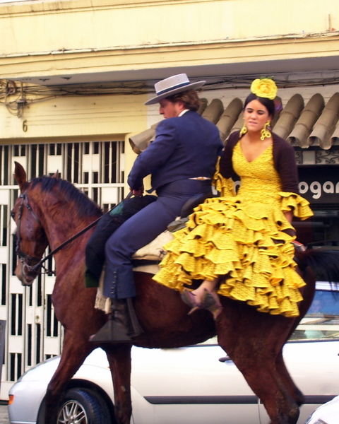riding a horse to Feria