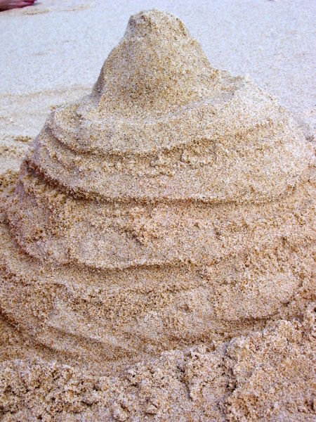 Katie's attempt at making a sand castle...complete with roads and a moat!