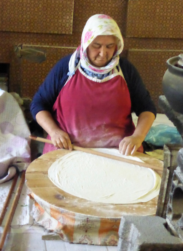 Rolling out dough to make gozleme
