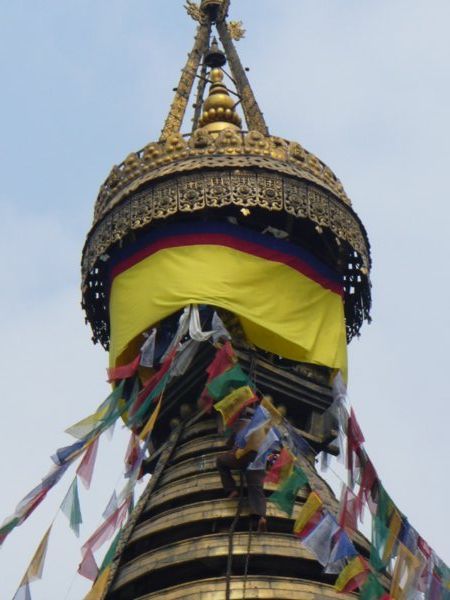 Gilded rings on the top of the huge white mound, or Stupa at Swayambunathe Temple, Kathmandu