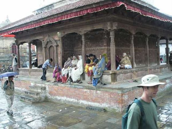 Ladies sheltering and singing in Durbar Square