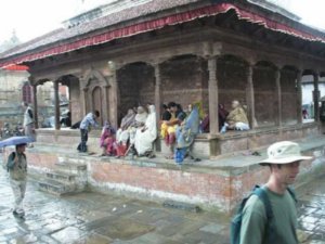Ladies sheltering and singing in Durbar Square