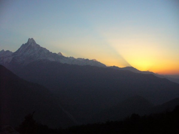 Sun coming up behind the mountains in Nepal