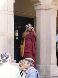 Buddhist monk with a video camera