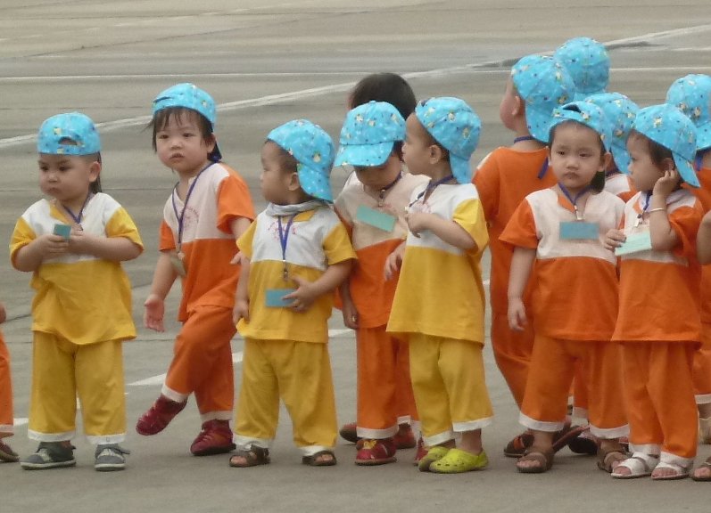 Tiny children visiting Ho Chi Minh's mausoleum