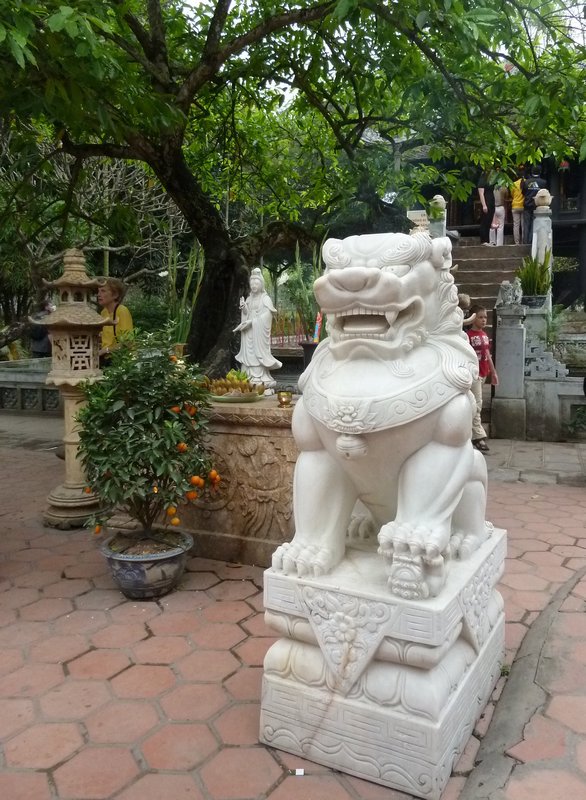 Lion guarding the one pillar pagoda