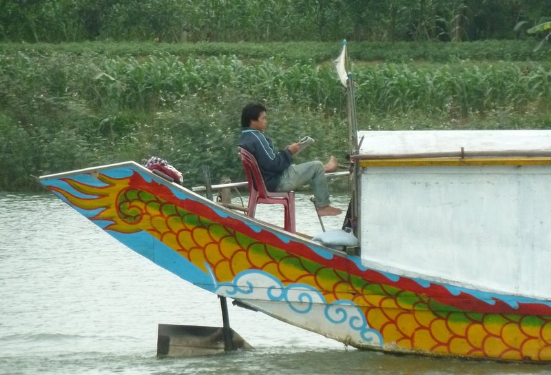 Taking it easy on a boat on the Perfume River, Hue