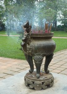 Burning incense at the Thien Mu Pagoda