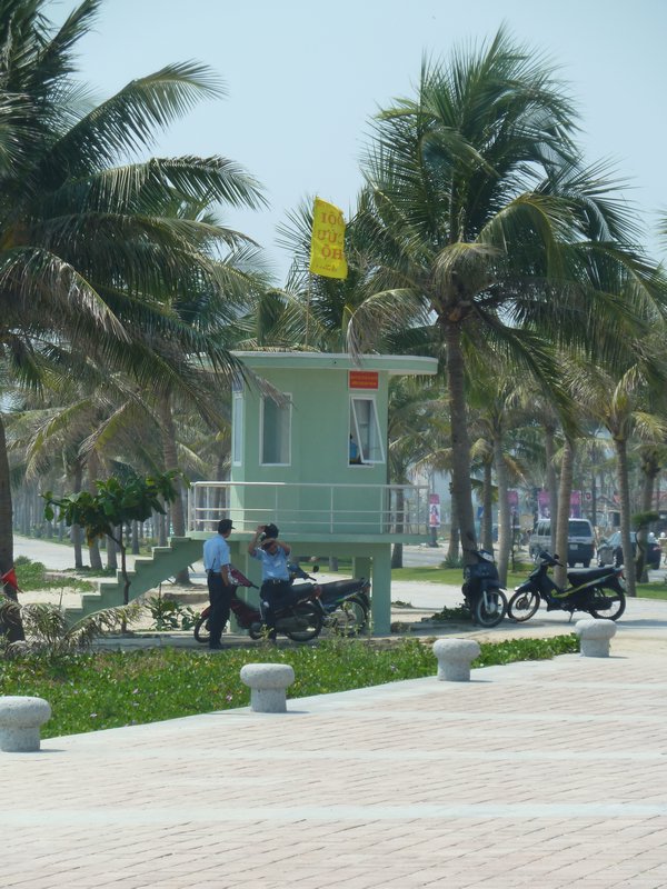 Police having a lazy day by the beach at Danang