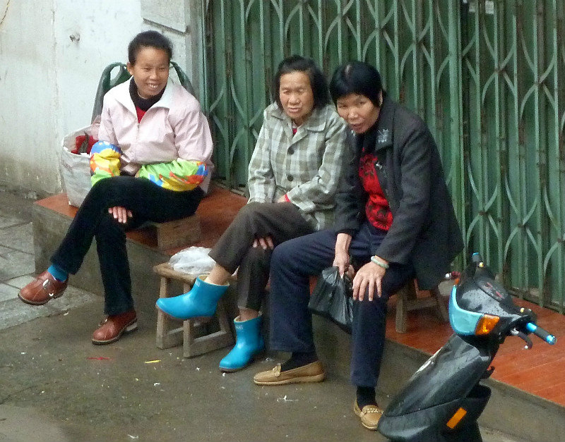 Local Yangshuo women watching the world go by