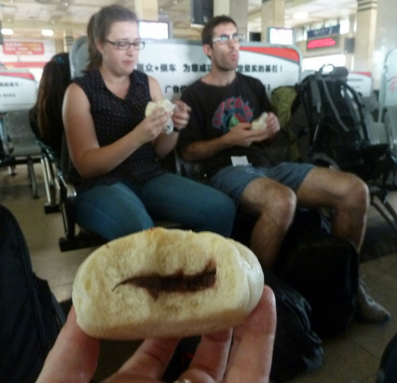 Eating our dumplings while we wait for the sleeper train to Chongqing
