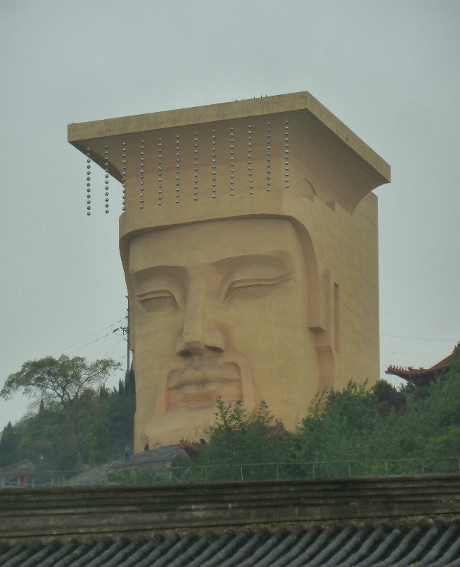 Huge statue on the hillside at the Ghost City