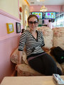 Renee posing in her new sunglasses in the Chintzy chairs.