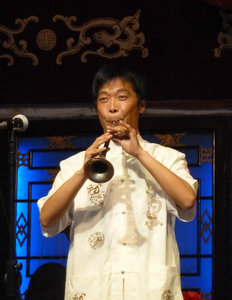 Playing the squarky instrument at the Chengdu Cultural Show