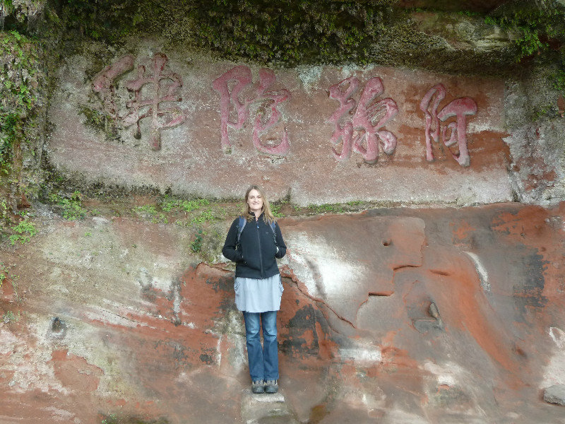 Posing on the way up the hillside to see the Leshan Buddha