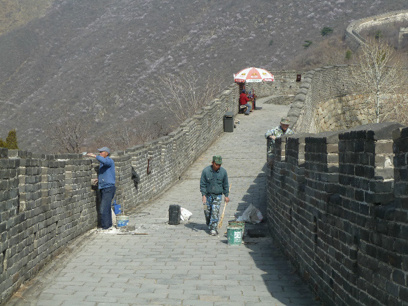 Workmen making some running repairs to the Great Wall of China