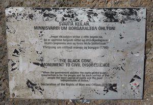 Plaque explaining the black cone monument to civil disobedience