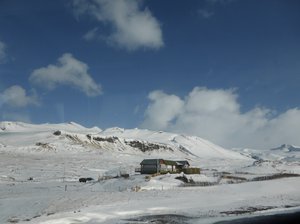 Snowy mountain views on the way to Stakkisholmur