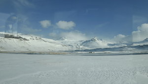 Snowy mountain views on the way to Stakkisholmur