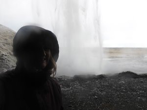 Standing behind Seljalandsfoss Waterfall