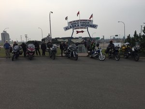 Group Photo at Monument of Alaska Highway. 