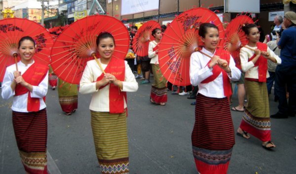 Girls in traditional dress with Bor Sang umbrellas