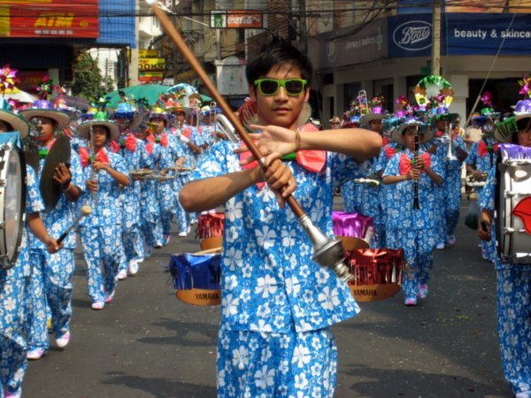 Local marching band in floral costumes