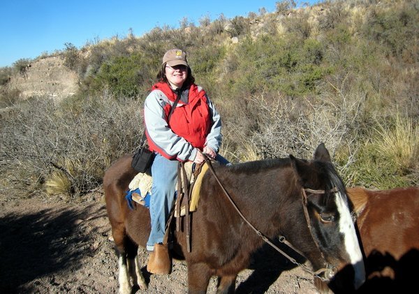 Dee on her horse in the Andes foothills