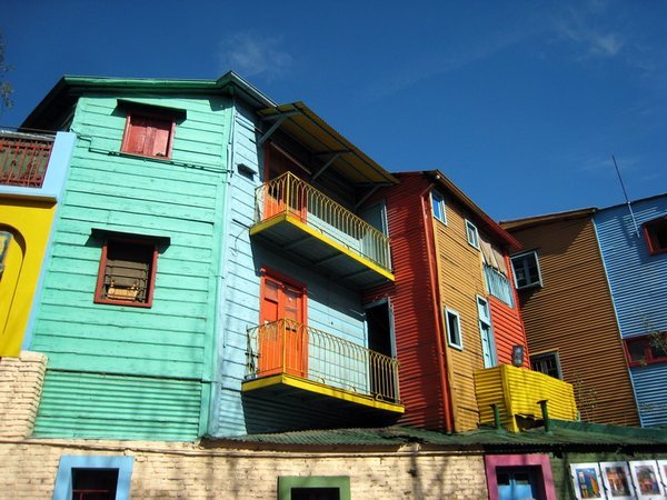 Tin houses decorated with leftover paint from the shipyards