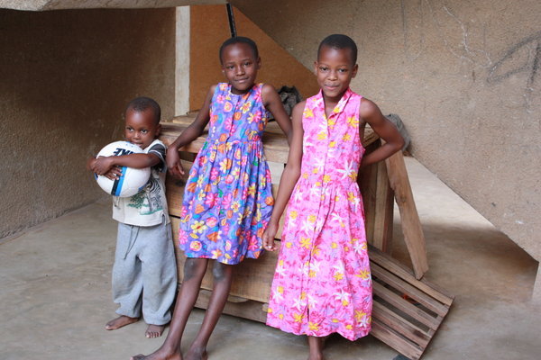 Alafati and his sisters with their new dresses from Lindsay and Leanne