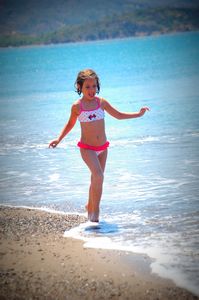 Sophia running on the beach