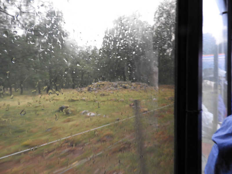 Viking Burial Mound thru Rainy Train Window