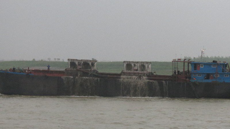 Ship collects sand for making concrete but also dredging the river