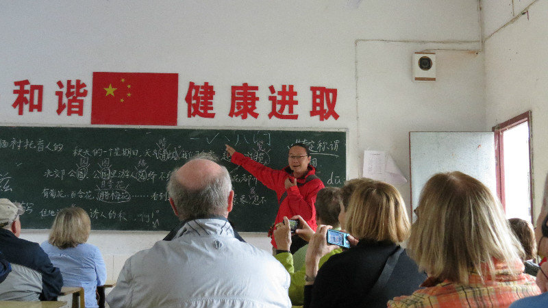 Our Escort Arnold teaching us Chinese Characters during the school visit